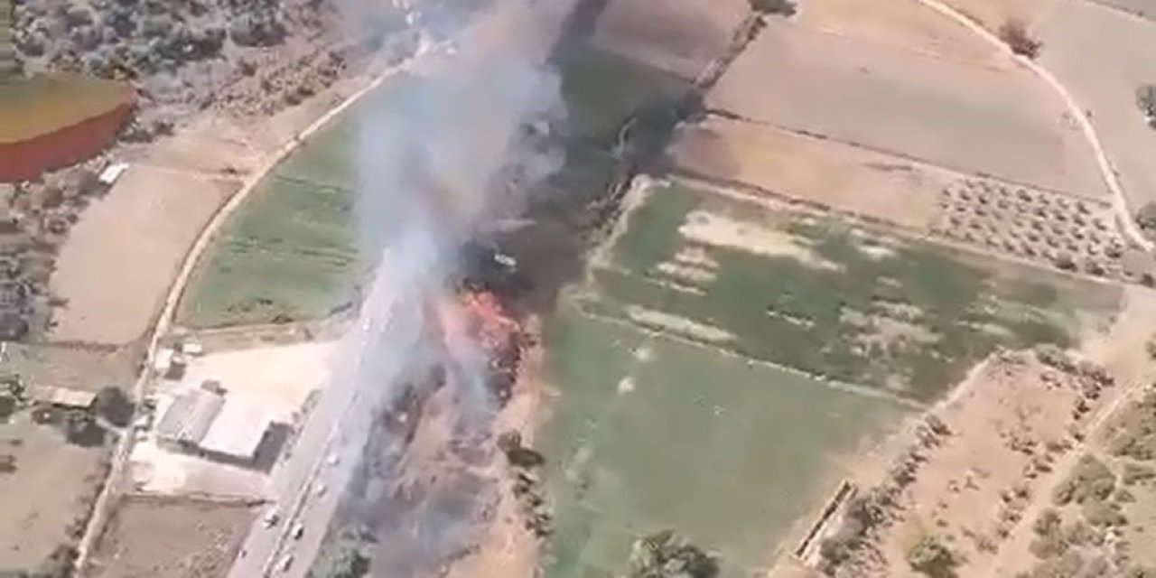 Milas’ta yol kenarındaki otluk arazide çıkan yangın söndürüldü