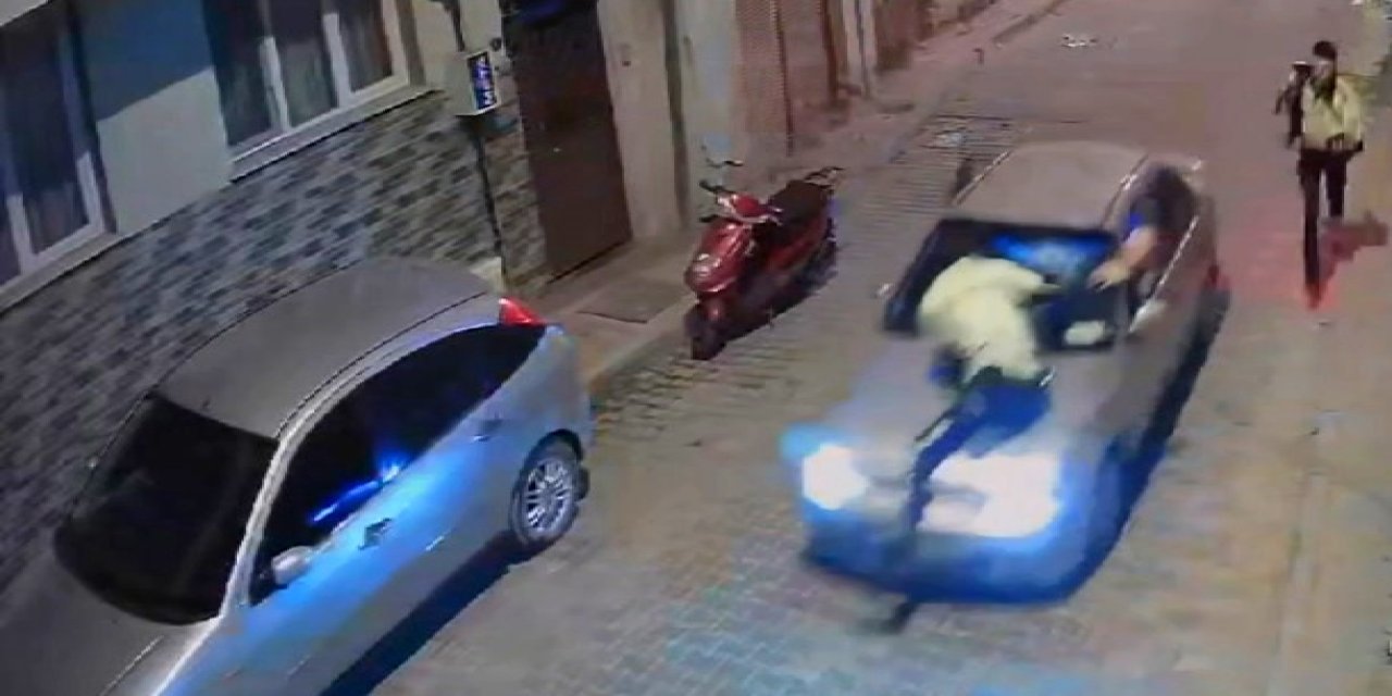 Dur ihtarına uymayan sürücü, polisi kaputta götürdü