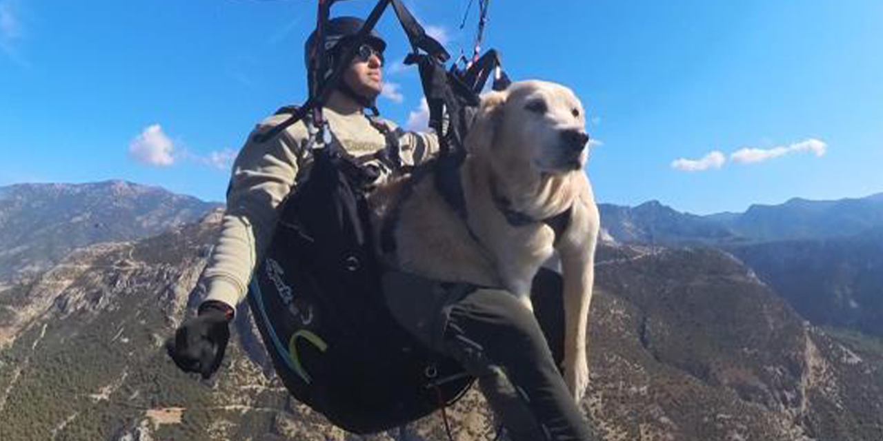 Köpeğiyle birlikte bin 700 metreden atladı