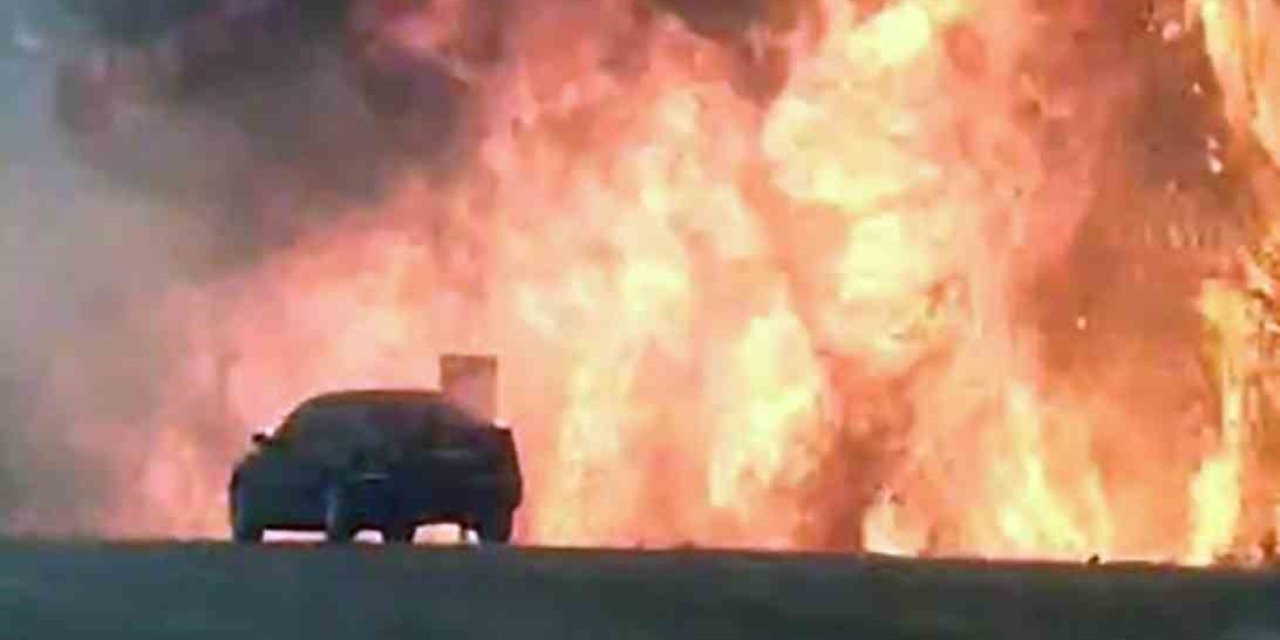 Orman yangınında araç alevlerin arasında kadı