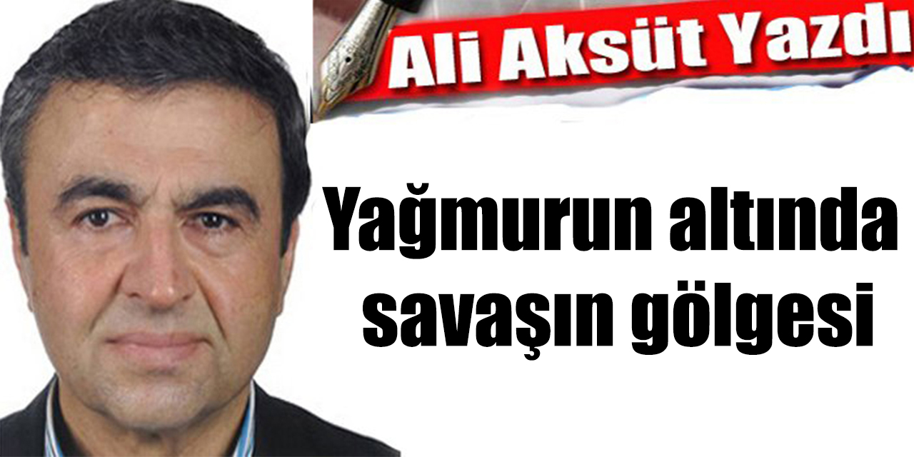 Yağmurun altında savaşın gölgesi