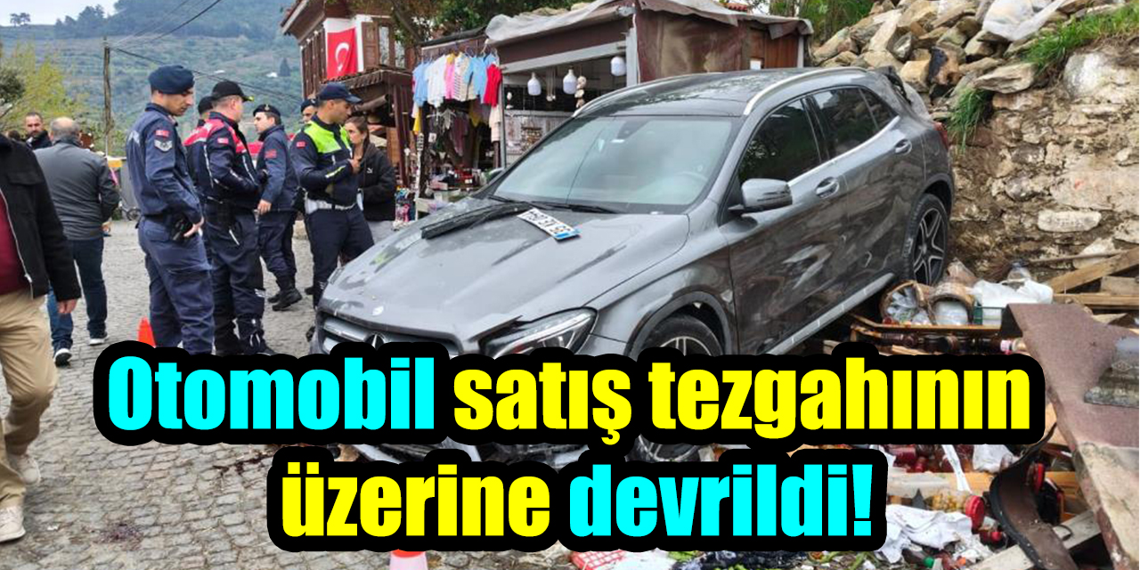 Otomobil satış tezgahının üzerine devrildi!