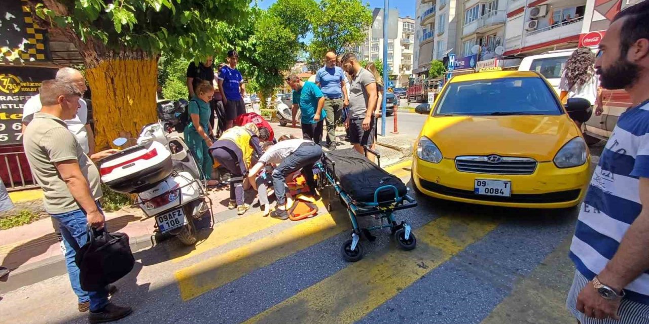 Efeler’de yolun karşısına geçmek isteyen kadına taksi çarptı: 1 yaralı