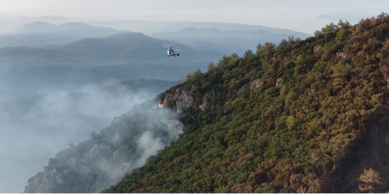 Fethiye’de ekiplerin orman yangını ile ilgili mücadelesi sürüyor